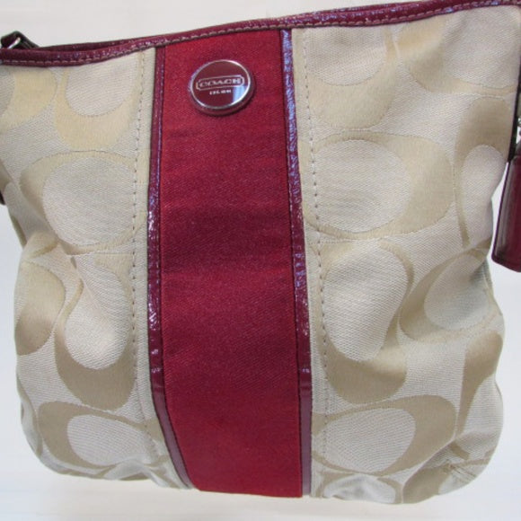 Coach purse with top red stripe